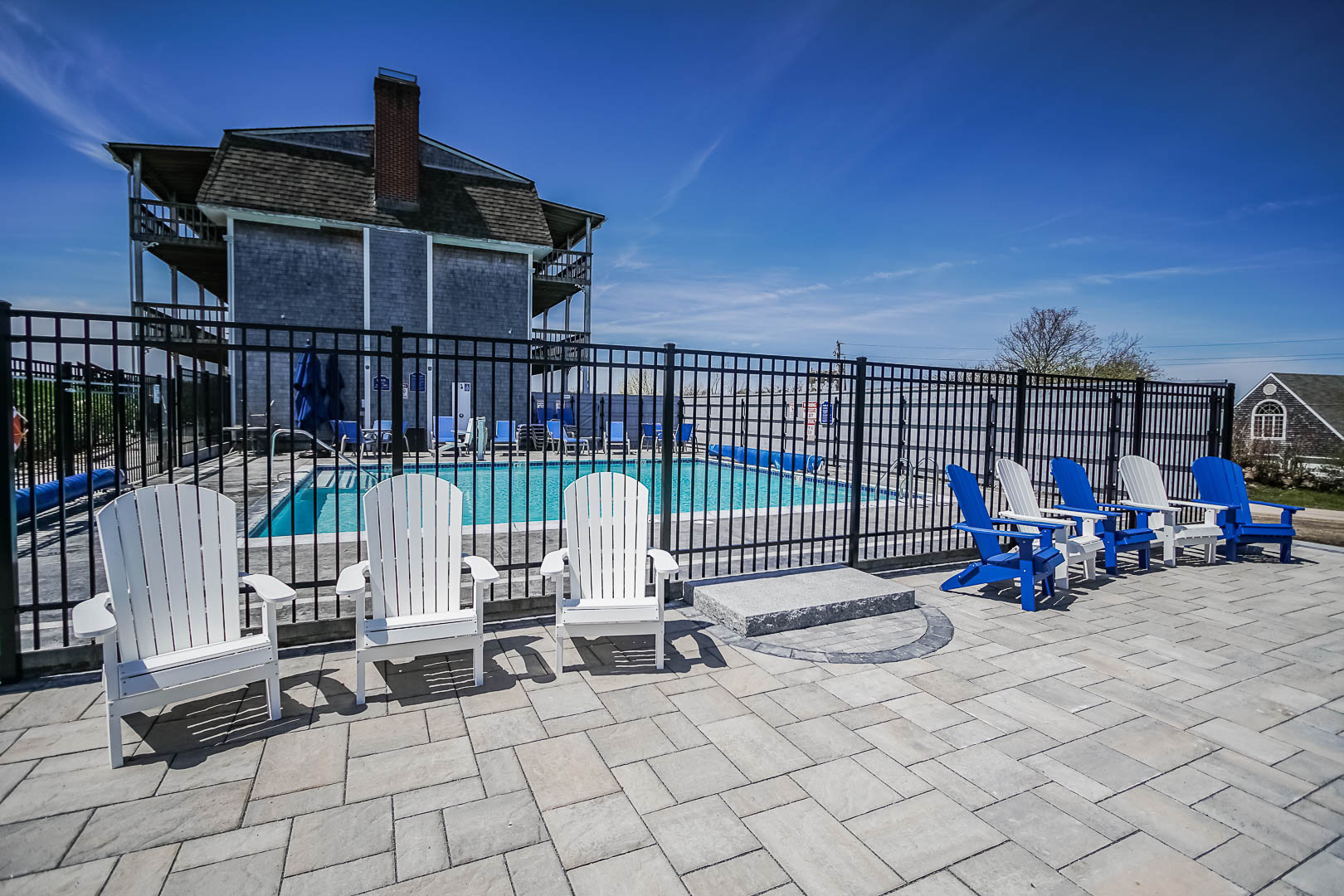 A spacious swimming pool area at VRI's Neptune House Resort in Rhode Island.